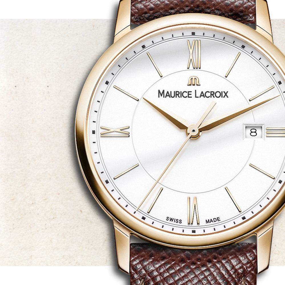 Maurice Lacroix Eliros Dameshorloge 30mm met witte wijzerplaat, goudkleurige kast en bruine leren band. Elegant Swiss Made dameshorloge.